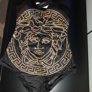 Medusa embossed beachwear.